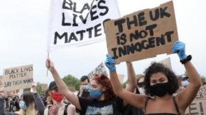 Protestors holding Black Lives Matter signs