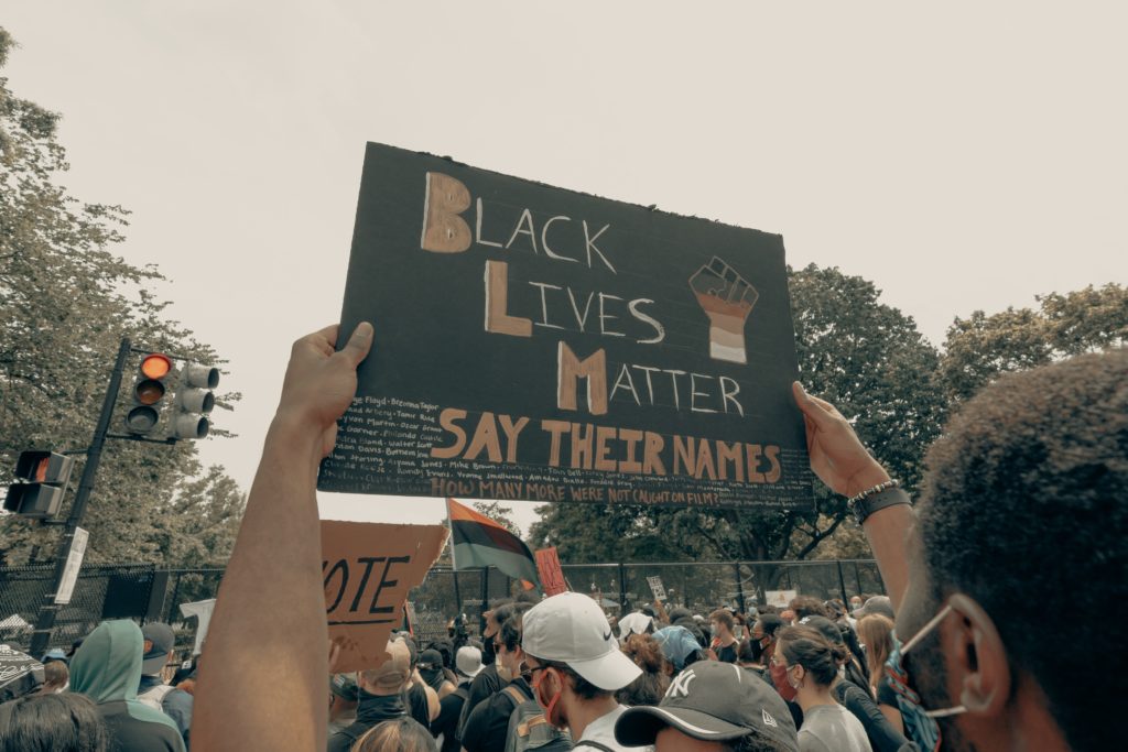 Protestor holding Black Lives Matter sign